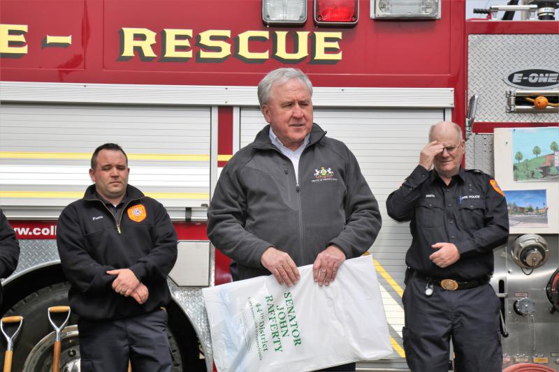 Senator John Rafferty presenting the Fire Company with a Check for $145.000.00